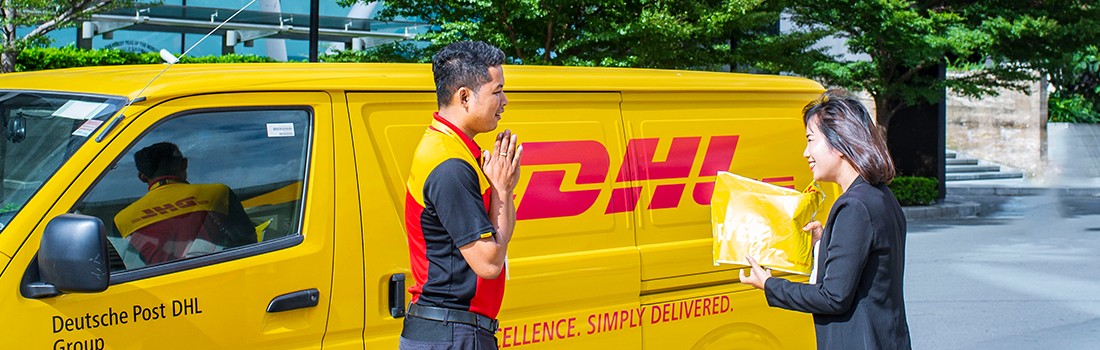 A DHL courier is delivering a shipment